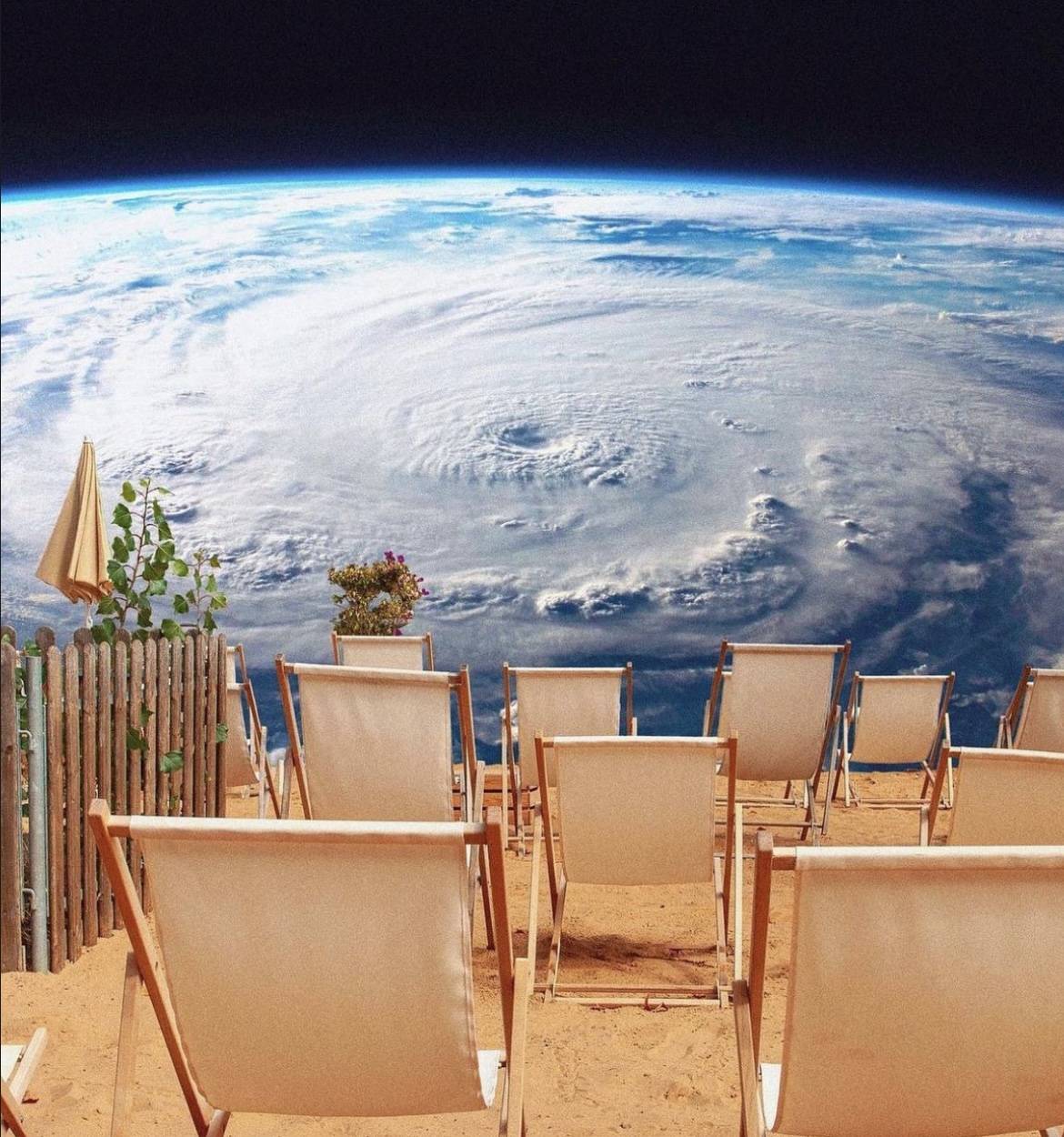 A row of beach chairs facing a view of Earth from space, with a hurricane visible.