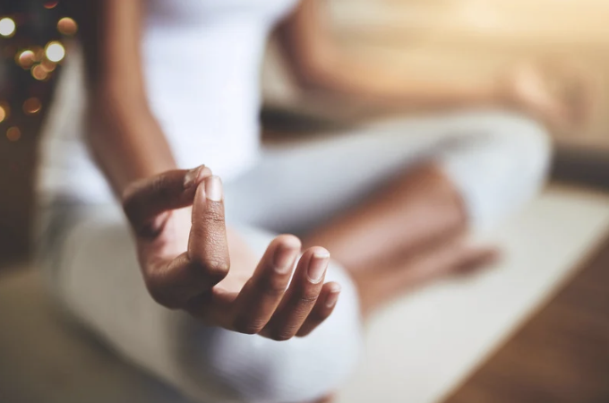 person meditating, symbolizing inner peace and mindfulness.