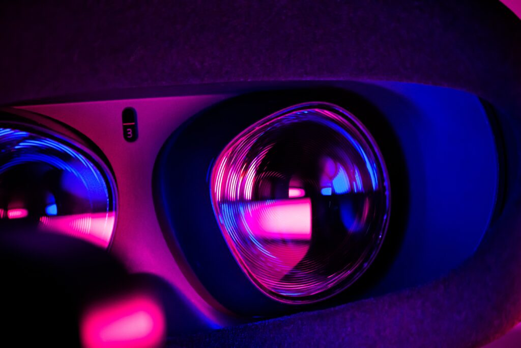 A close-up of a VR headset, glowing with vibrant colors.